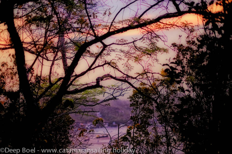 Walking back to our catamaran Yemaya we see this night view on lower beach Bequia.