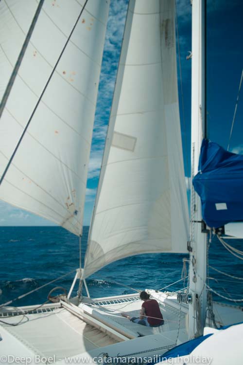 Sailing to Curacao. Sails are in "milkmaid" setting