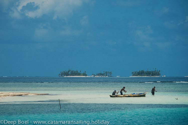 Indians fishing with sailing canoe in the San Blas